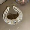 Collana corta da donna retrò con perle multiple, esagerata e atmosferica