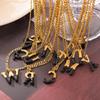 Minimalist Light Luxury Titanium Steel Initial Necklace, Non-Fading with Black Drip Oil.