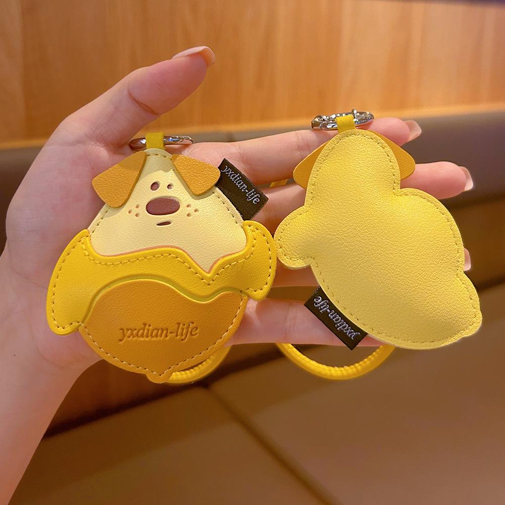 Creative Cartoon Mango Pudding Dog Leather Keychain - Cute Fruit Pendant for Girls' Bags.