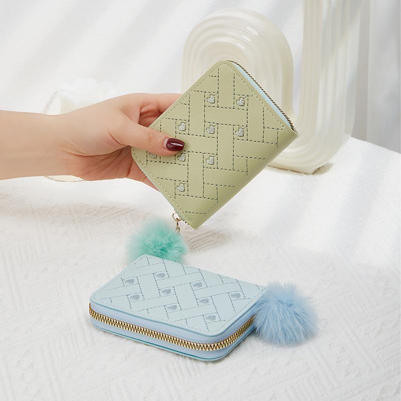 New single zipper multi-functional short women's change bag fashionable and simple hairball decorative wallet