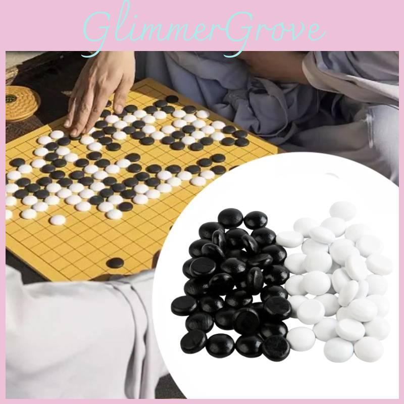 Elegant Black And White Wooden Game Pieces For Versatile Chess And Go Gameplay