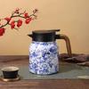 Insulated Stainless Steel Kettle with Tea and Water Separation - Elegant Chinese Style for Home or Office Use.