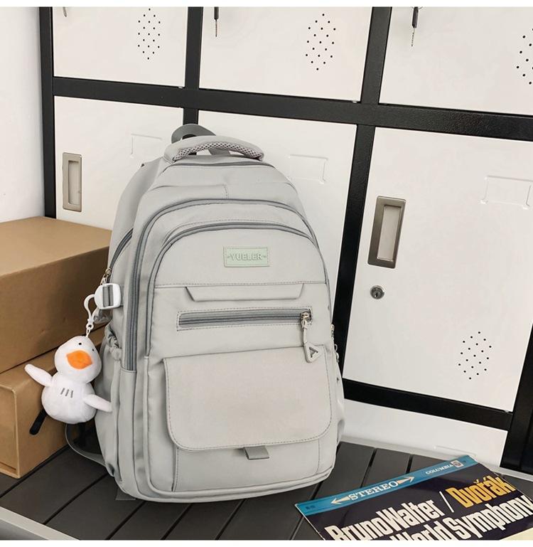 Schoolbag high-value simple casual couple travel backpack large capacity junior high school students multi-compartment backpack men