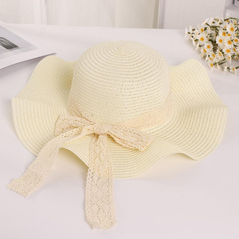 Summer wavy edge bow streamer straw hat seaside outing idyllic sunshade sun protection UV protection sun hat