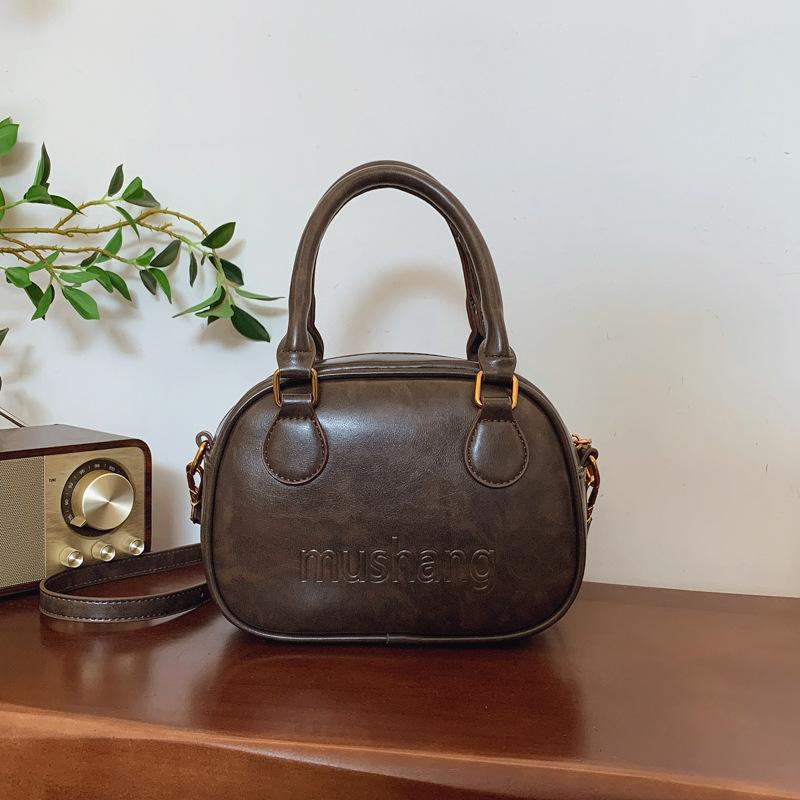 Niche Design Simple Texture Portable Bowling Bag Women's 2025 Autumn and Winter New Fashion Retro Messenger Shoulder Bag