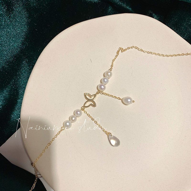 Retro butterfly pearl necklace women s new super fairy fringed collarbone chain light luxury niche neck chain