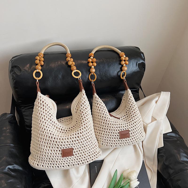 Holiday style woven bag women's 2025 new knitted hollow shoulder bag fashionable large-capacity messenger bag beach bag