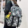 Schoolbag: Trendy Brand Harajuku-style Backpack for Men, Large Capacity for Middle and High School Students, Fashionable Camouflage Graffiti Backpack 