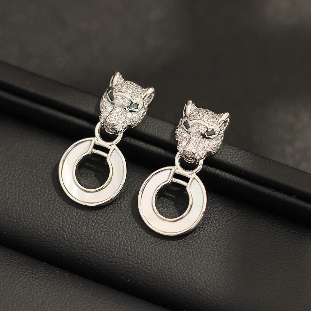 European and American classic high-end personality stone inlaid leopard earrings gold and silver two-color stone inlaid animal shell earrings silver n