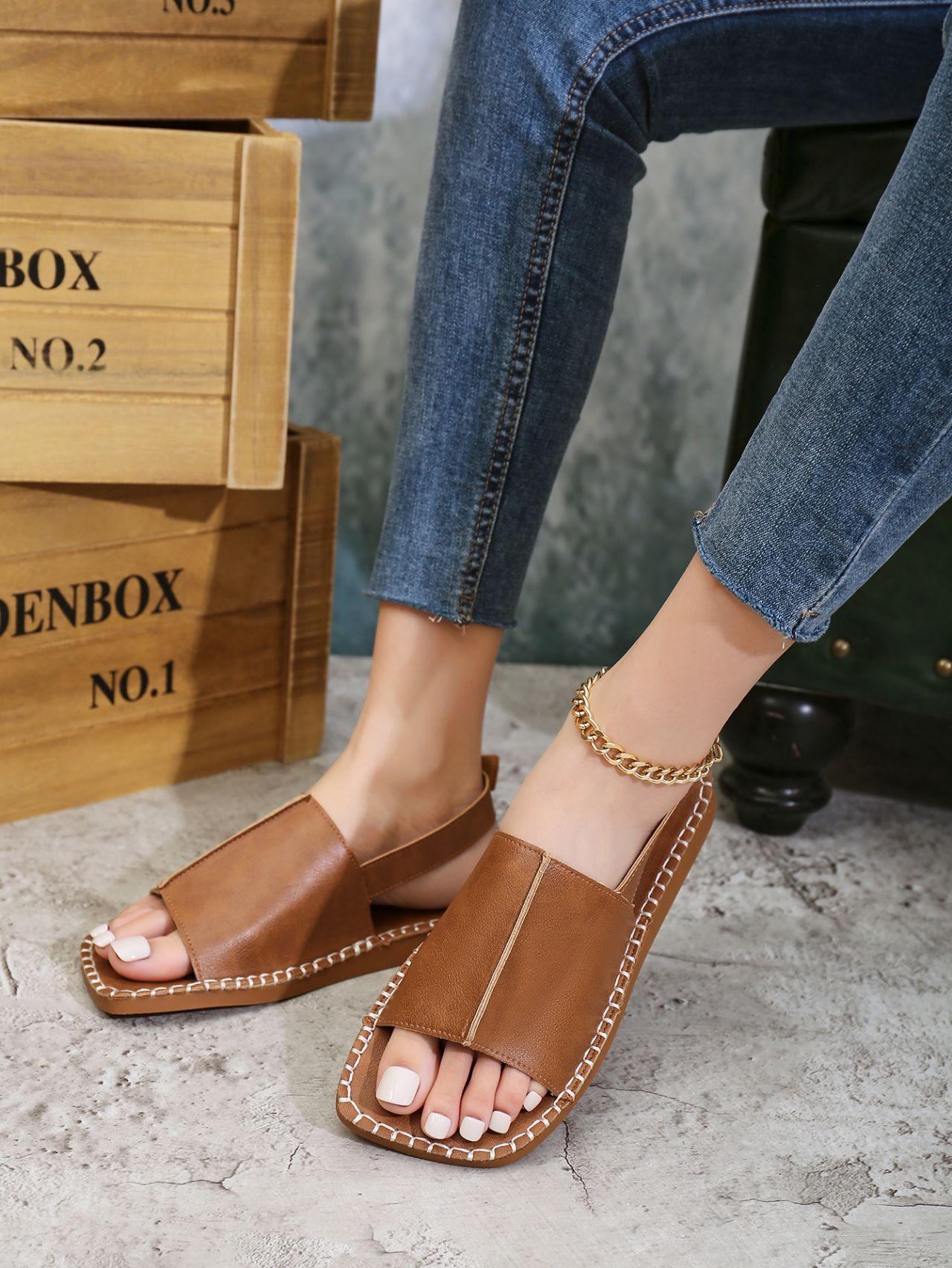 

Летом 2025 года новые европейские и американские сандалии с плоской подошвой и пряжкой в виде рыбьего рта больших размеров для женщин теперь 42 темно-коричневого