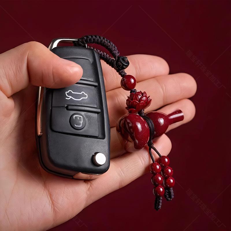 

Cinnabar Gourd Pendant Keychain with Lotus Design for Benmingnian