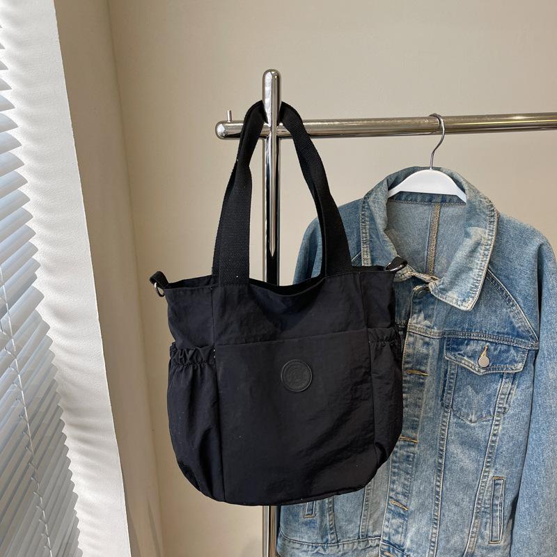 Large-capacity bag women's new spring and summer casual shoulder messenger bag texture class commuter tote bag