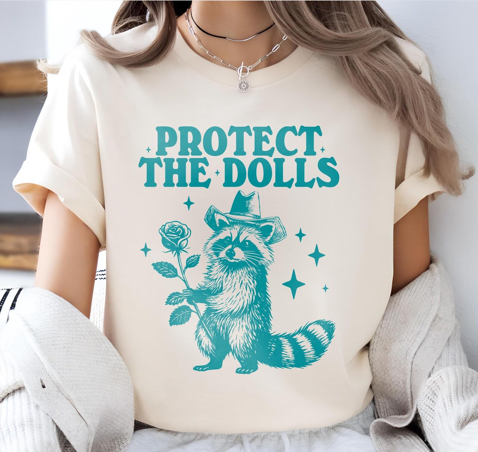 Protect The Dolls Shirt, Funny Raccoon Meme Shirt, Gender Equality Shirt, Human Rights Activist Top, Trans Rights Cute Raccoon T-Shirt 4XL