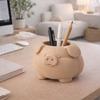 A Container In the Shape of a Plump Beige Pig