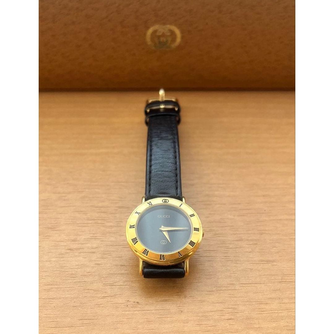 Used GUCCI watch quartz black dial gold bezel