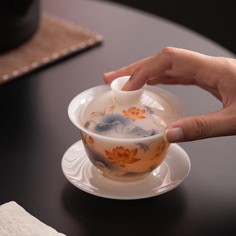 Ice seed jade porcelain hovering Sancai cover bowl Dehua white porcelain Kung Fu tea set household tea brewer gift hand-painted household