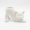 A White Flowerpot In the Shape of a Stretching Cat for Succulents and Cacti.