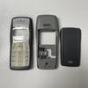 Celý zadní kryt pro Nokia 1100 Kryt baterie Zadní kryt Střední rám Arabská klávesnice Tlačítko