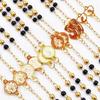 Schwarze Kreuzkette mit Goldakzenten, Multi-Accessoire - Edelstahl-Rundperlen-Schutzkette für Damen