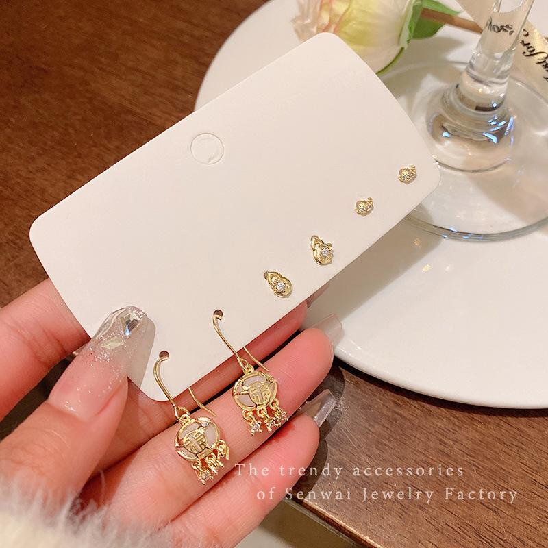 

Three pairs of zircon safety lock set earrings women s exquisite high-end studs Korean retro earrings