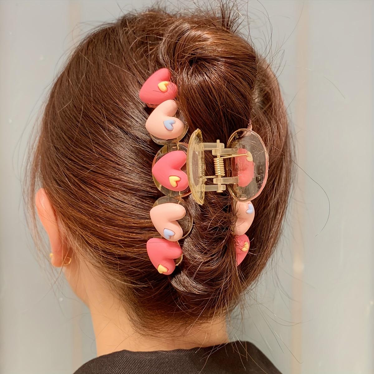 

A Stylish And Elegant Basic Hair Claw for Women, Featuring a Heart Design in Two Colors, Perfect for Everyday Wear.