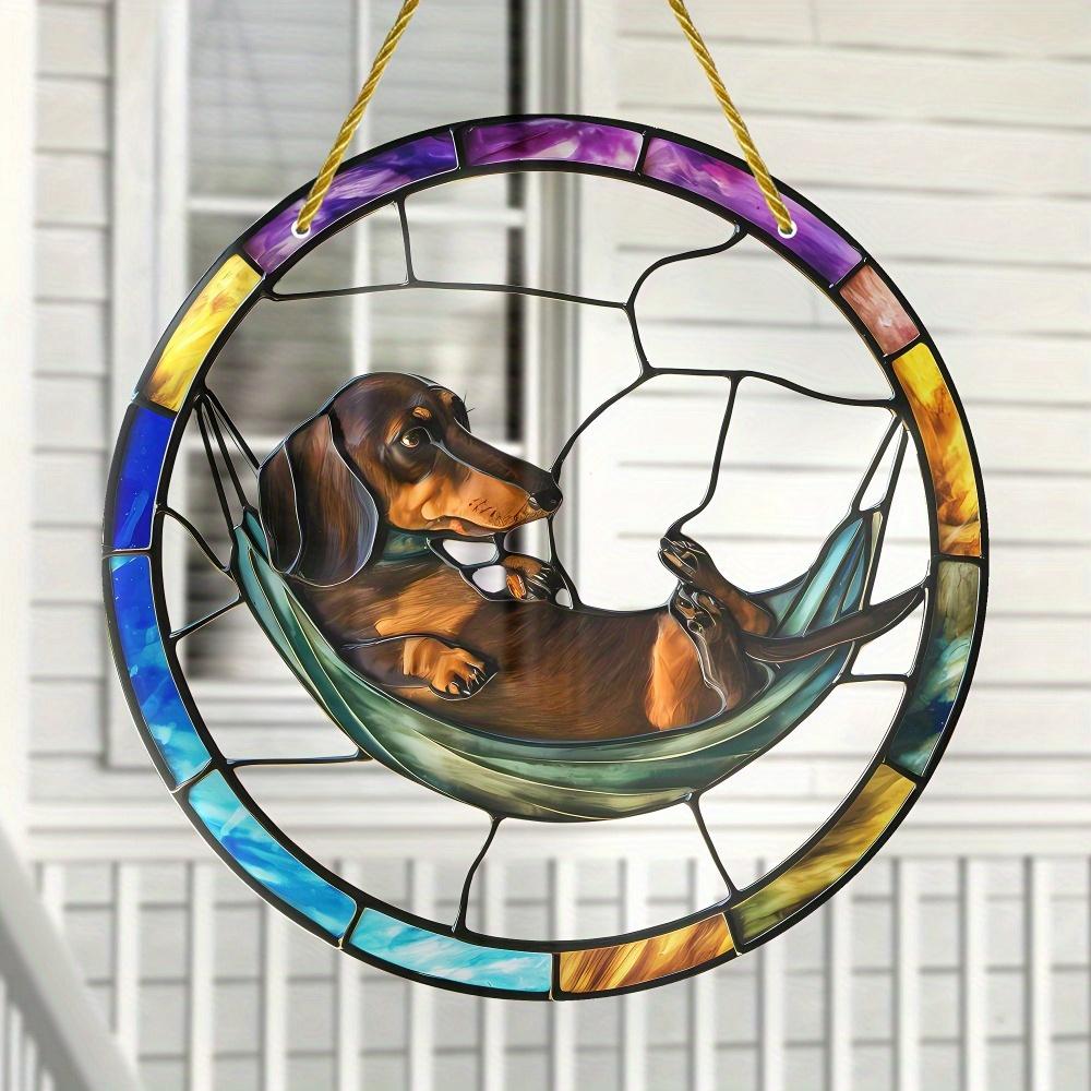

Dachshund hammock light catcher, a unique circular pendant for dog lovers. Perfect home and garden decor. чистый