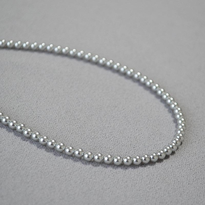 

Ожерелье из искусственной пеньки с кристаллами и жемчугом «French Moonlight» и серебристо-серым узором