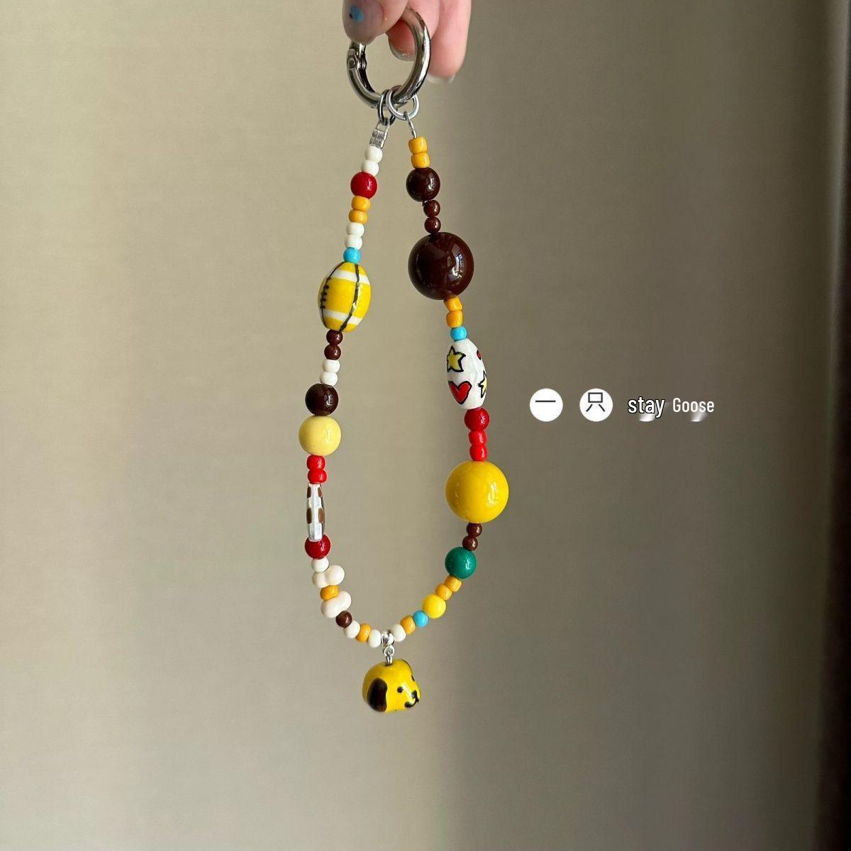 

Ручной работы Желтый Щенок Регби Телефонный Шарм: Бисерный кулон-шнурок