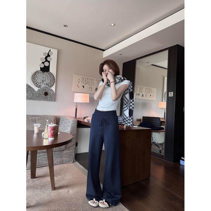 

Женские спортивные брюки с высокой посадкой и широкими штанинами темно-синего цвета - Коллекция Осень/Зима 2024 L