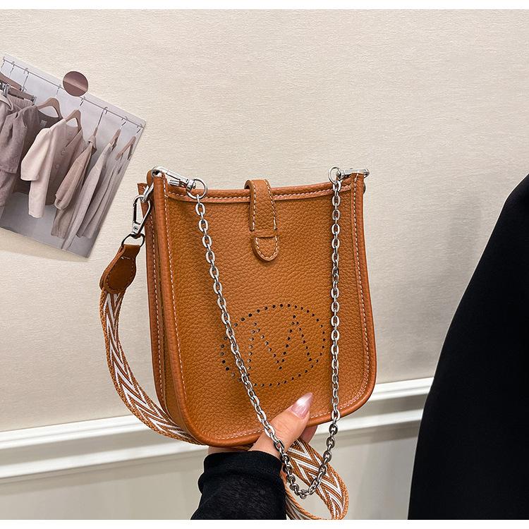 

Stylish and simple mini casual 2025 spring new shoulder crossbody small bag underarm hollow bucket women s bag tide