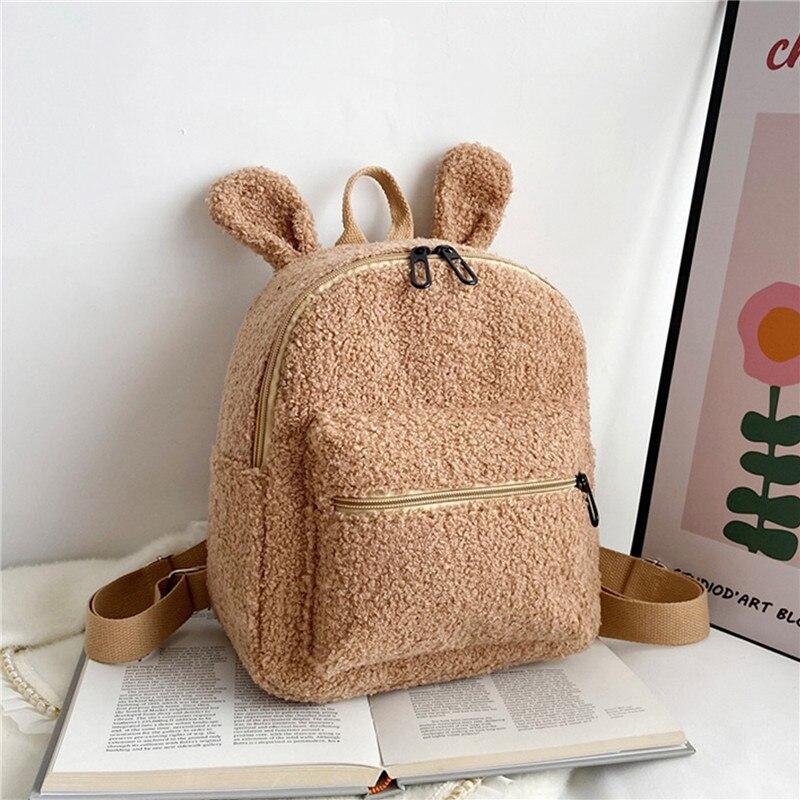 

Новейший рюкзак в форме пушистого кролика, однотонный, пушистый, дикий, мягкий, плюшевый, школьная сумка с ушками кролика для маленьких девочек