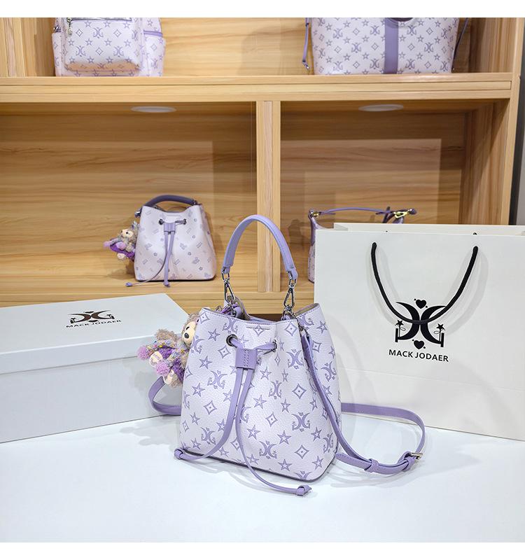 Women's Large Capacity Single Shoulder Bucket Bag with Inner Lining, Compartment Organizer, and Zippered Middle Section.