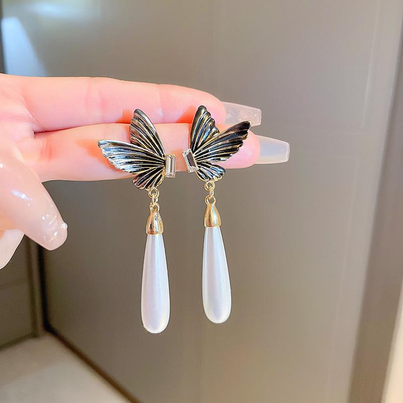 Fashion Geometric Bow Flower Pearl Earrings Women'S Premium Versatile Small Fragrant Wind Earrings