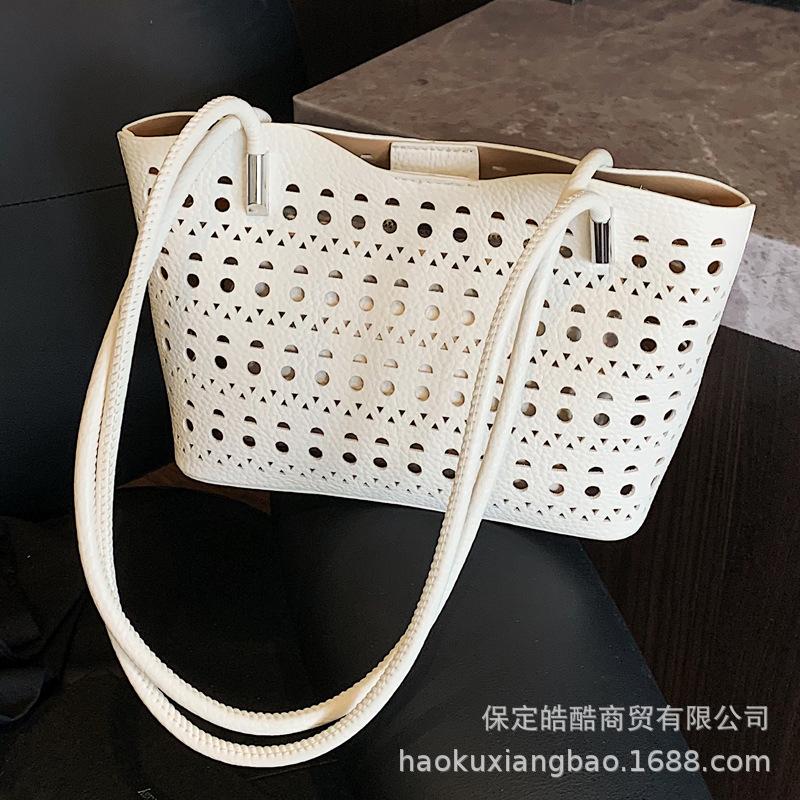 Large-capacity hollow bag women's summer 2025 new versatile shoulder mother and child bag leisure work commuter tote bag