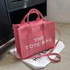 New women's bag women's new solid color pu letter tote bag simple casual messenger large capacity portable