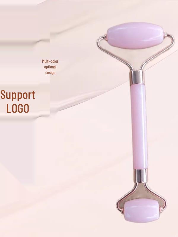 Heart-Shaped Rose Quartz Facial Roller & Gua Sha Massager for Skin Lifting and Muscle Relaxation.