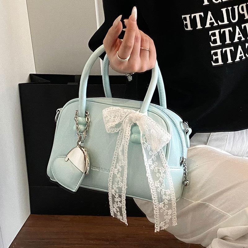 Korean version of the hot sale niche simple solid color hand pillow bag versatile fashion high texture commuter messenger bag women