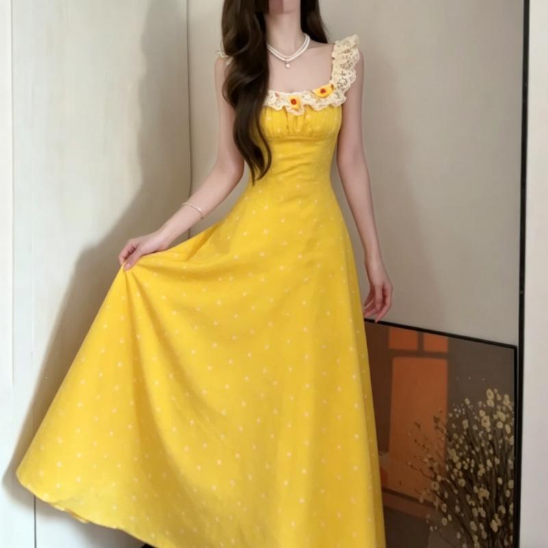 French holiday style yellow dress women's summer 2026 new super fire wear with floral suspenders long skirt sleeveless