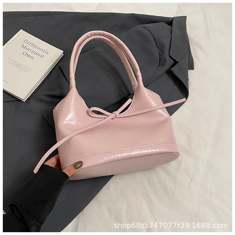 Bow niche portable bucket bag women's 2025 new trendy fashion simple commuter casual shoulder bag
