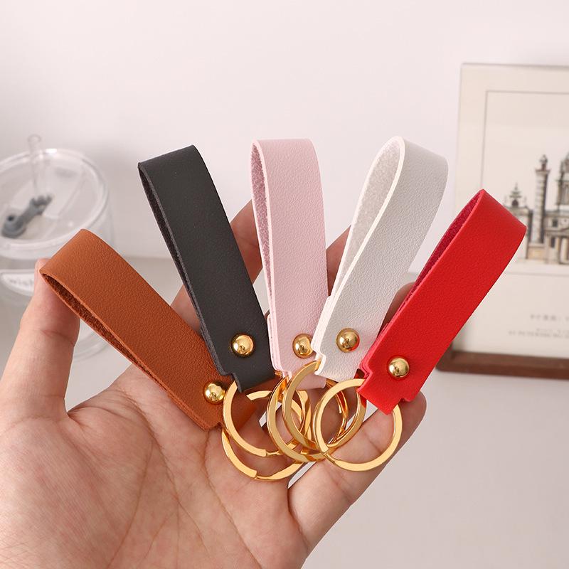 Creative Minimalist PU Leather Keychain: Solid Color Car Anti-Lost Pendant and Bag Accessory