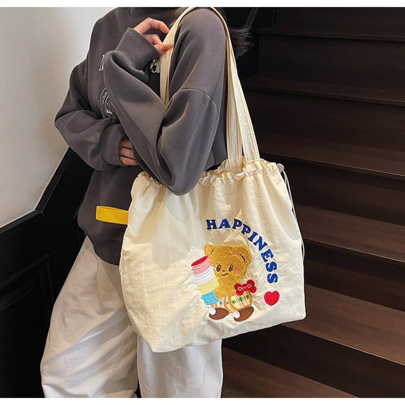 The new School of Arts and Art style is simple and large-capacity tote bag, and women's tide is popular. Versatile commuter shoulder bag.