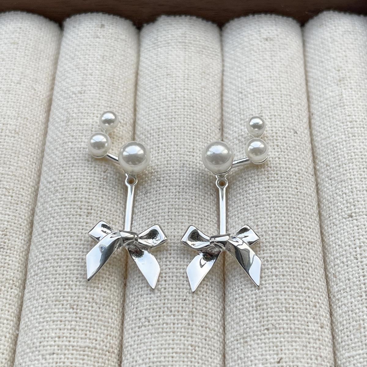 

Xiaoxiangfeng sweet bow silver needle stud earrings women s exquisite rear hanging pearl earrings New Year s earrings 925 silver needle