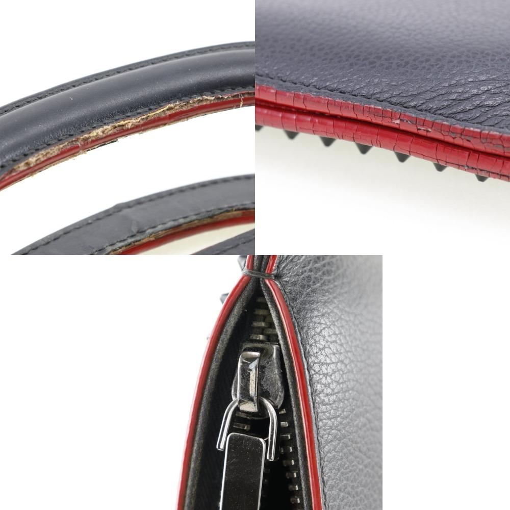 Christian Louboutin Trick Track Handtasche 2-Wege Clutch Nieten schwarz Kalbsleder Herren Gebraucht