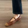 Sheepskin version retro round head Mary Jane shoes woven word with temperament camellia flat sole shoes