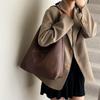 Retro portable bucket bag women's autumn and winter new large-capacity woven shoulder bag commuter tote bag