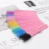 50-Pack Disposable Eyelash Brushes - Portable Pink-Handled Makeup Tool for Eyebrow and Eyelash Application.