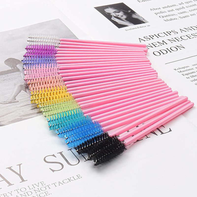 50-Pack Disposable Eyelash Brushes - Portable Pink-Handled Makeup Tool for Eyebrow and Eyelash Application.