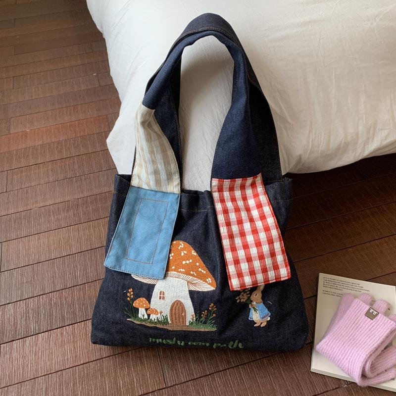 

2025 autumn new mushroom house embroidery niche large-capacity shoulder bag portable travel female student bag tote bag