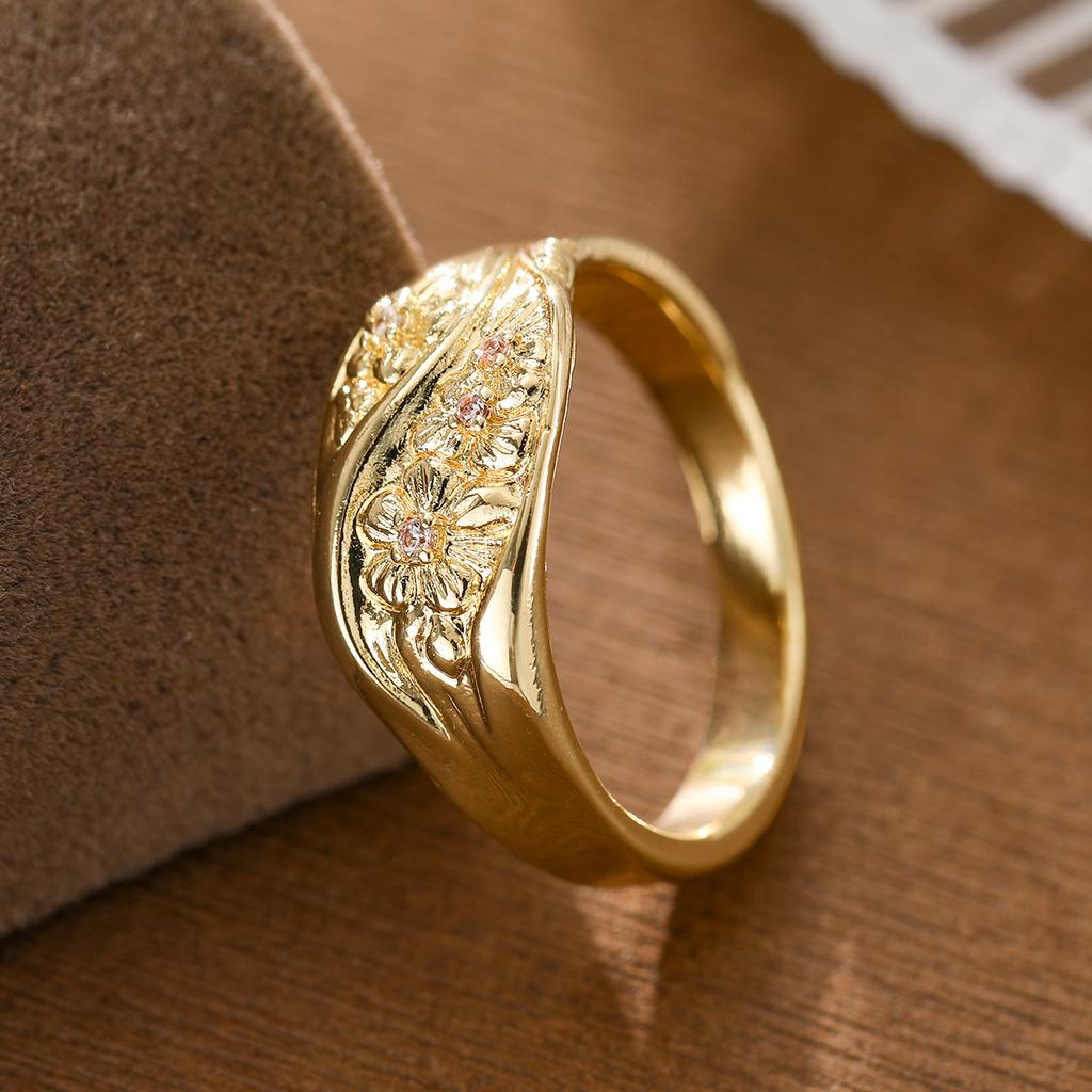 Retro-style relief flower-shaped artificial gemstone ring made of copper, suitable for ladies as a gift for shopping or dating.
