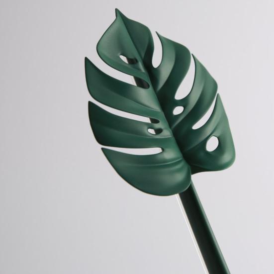 Nástroj na čištění sprchové stěrky ve tvaru zeleného listu